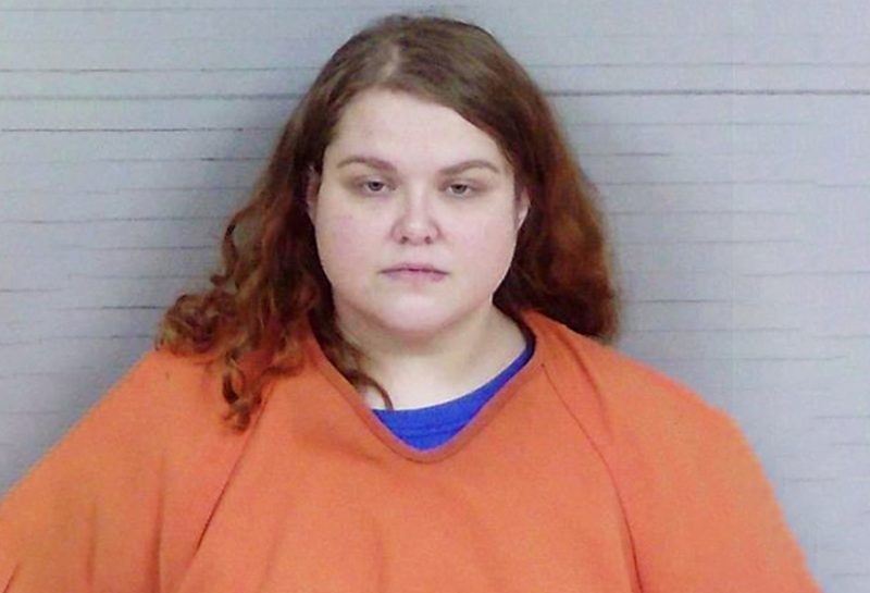 Wife sent her husband message that caused him concern for the well-being of their 11-month-old baby after she grabbed two knives, wrapped the infant in shower curtain inside the bathtub and used the knives to cut his neck; arrested